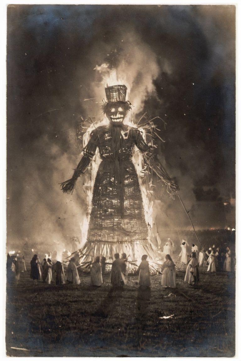 an enormous burning straw effigy,  in a field,  night time on Tensor.Art