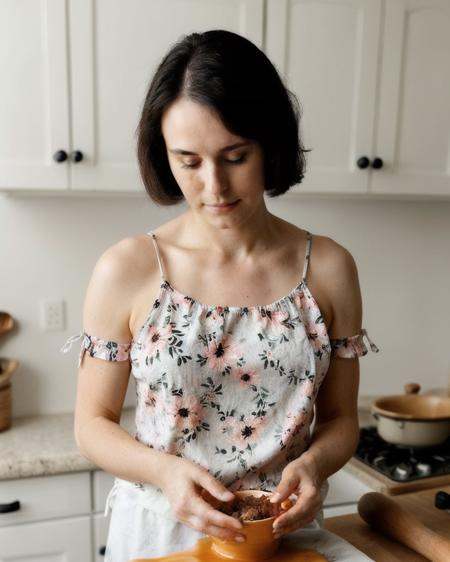 instagram photo of woman wearing a cute flowery top,  cooking,  looking down on Tensor.Art