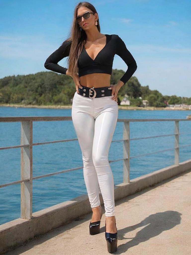 WOMAN in latex pink leggings and white latex top and,  fantasy leather clothing,  leather clothing on Tensor.Art