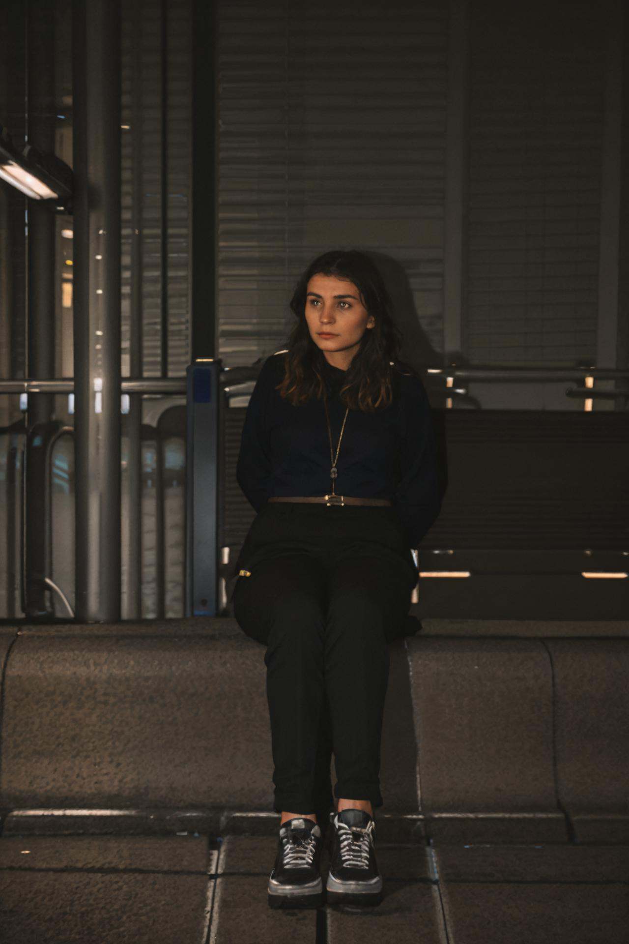medium shot of a woman traveller ready for the journey waiting on the train station,  detailed sharp,  flashphoto on Tenso...