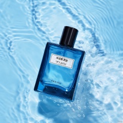  xihuwen,Perfume, Black pump head, top-down Angle, water, daytime, blue theme, Commercial photography, 8k, HD,