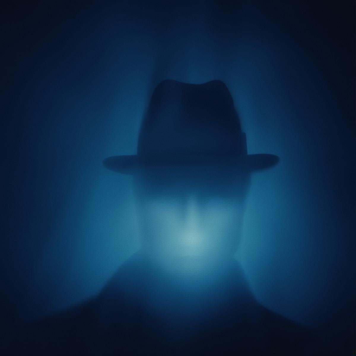 cinematic film still of volumetric lighting styleCloseup,  a close up of a rorschach face with a blue light,  solo on Tens...