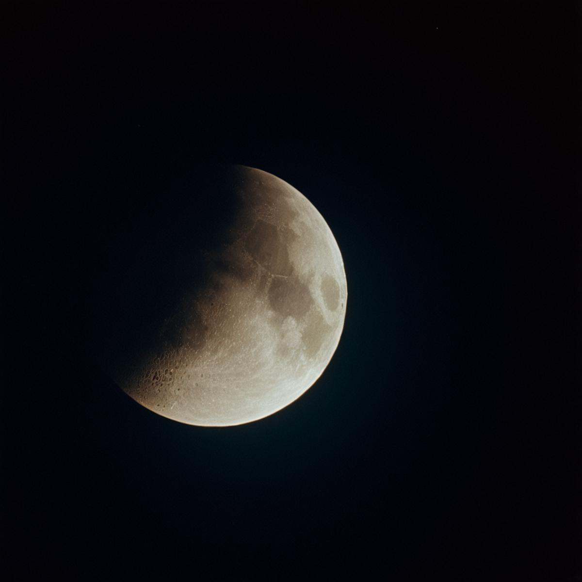 cinematic film still of "Kodak" "Vivid Film"a partial eclipse of the moon in the sky,  solo,  no humans on Tensor.Art