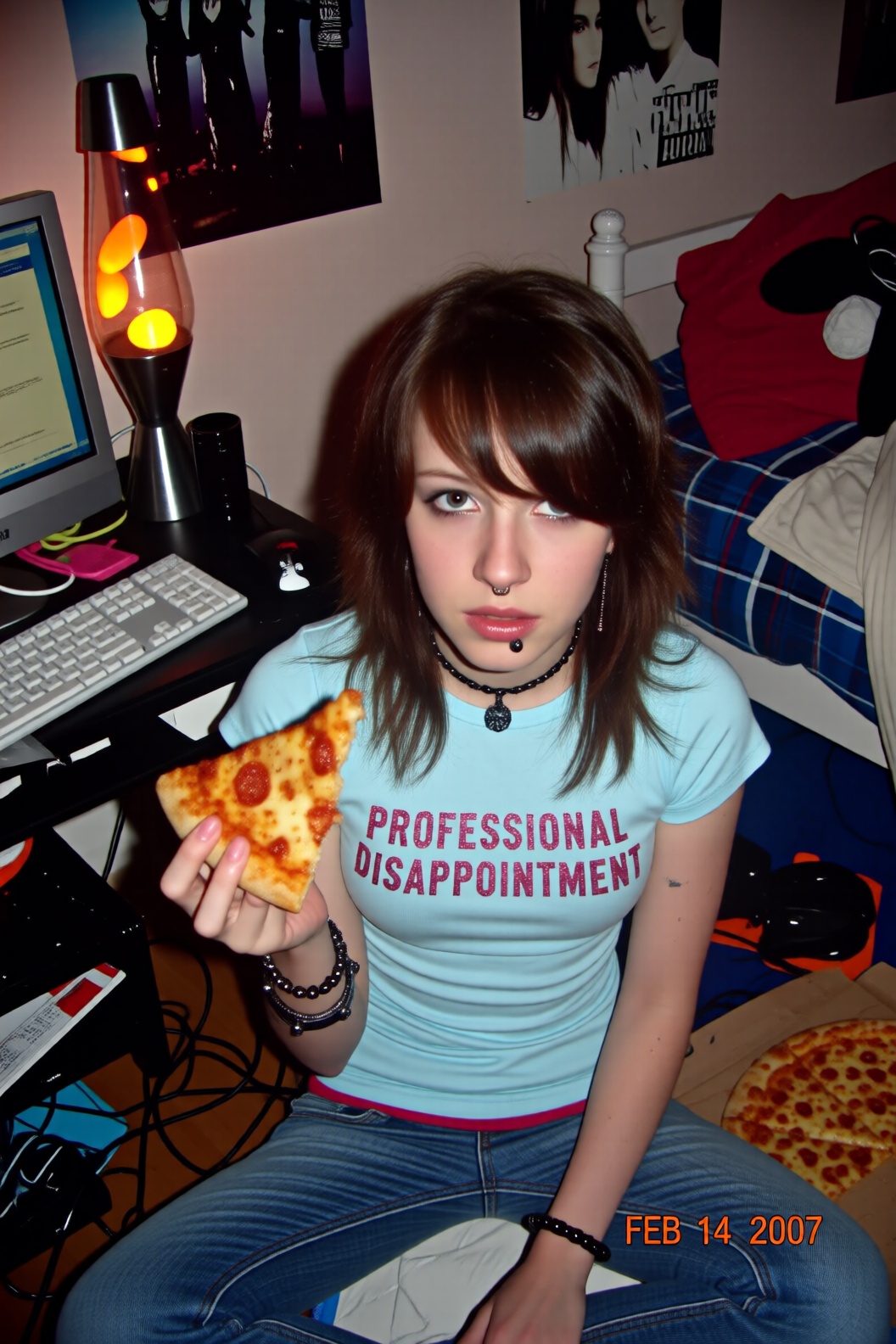 A medium-resolution camcorder video still,  taken from a high angle (MySpace angle),  showing a girl sitting on the floor...