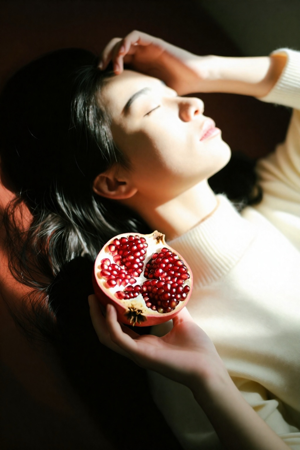 serene softly lit portrait woman lying down head tilted back gazing upward closed eyes dark wavy hair spreads gently half...