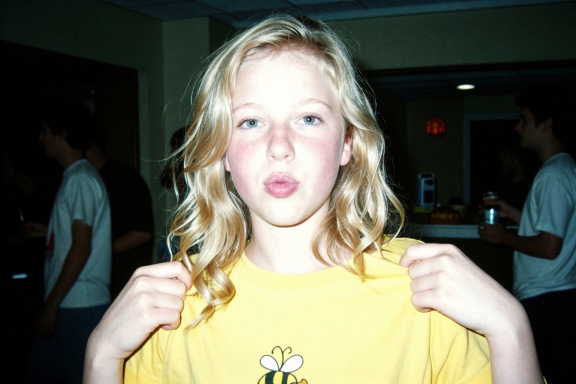 A candid,  lo-fi ******* digital photograph from the mid-2000s capturing a teenage girl with long,  voluminous blonde wavy...