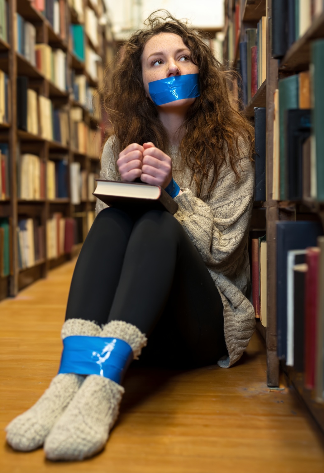 A soft-focus,  candid-style shot taken between the narrow aisles of an old,  dusty library. A woman with long on Tensor.Art