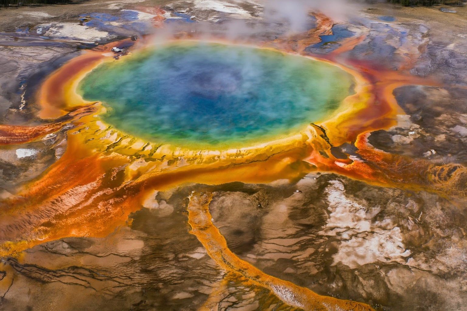 aurelmanea3z photography. An astonishing aerial or slightly elevated wide-angle view of the Grand Prismatic Spring in Yell...
