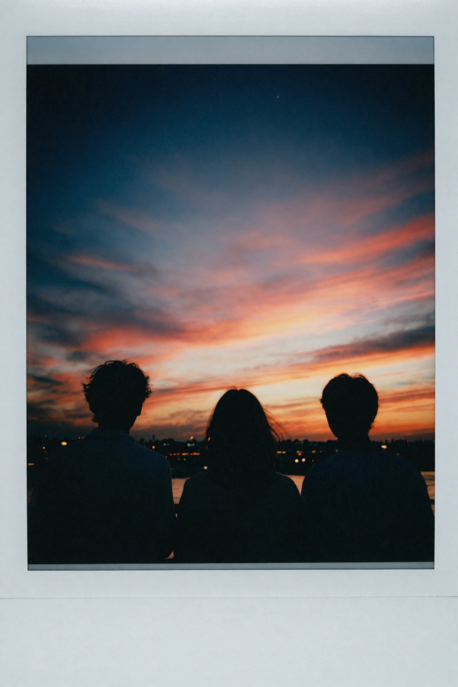 Candid Instax Photo,  The image is a photograph of three people standing in front of a beautiful sunset. The sky is filled...