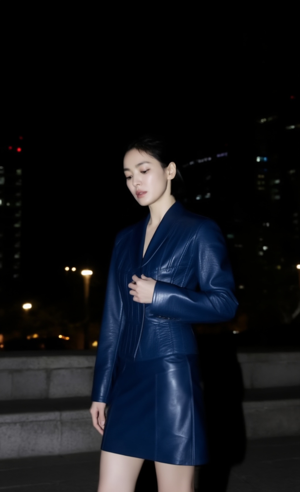 A realistic candid fashion portrait of a 20yo young woman at night in the city. Medium full-body framing,  slightly downwa...