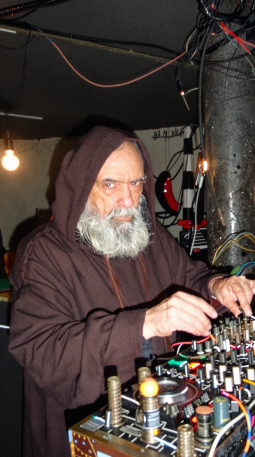 taken_by_ph0ne,  shaky mobile phone capture,  wide angle. A mysterious elderly European man in a hooded robe operating a s...