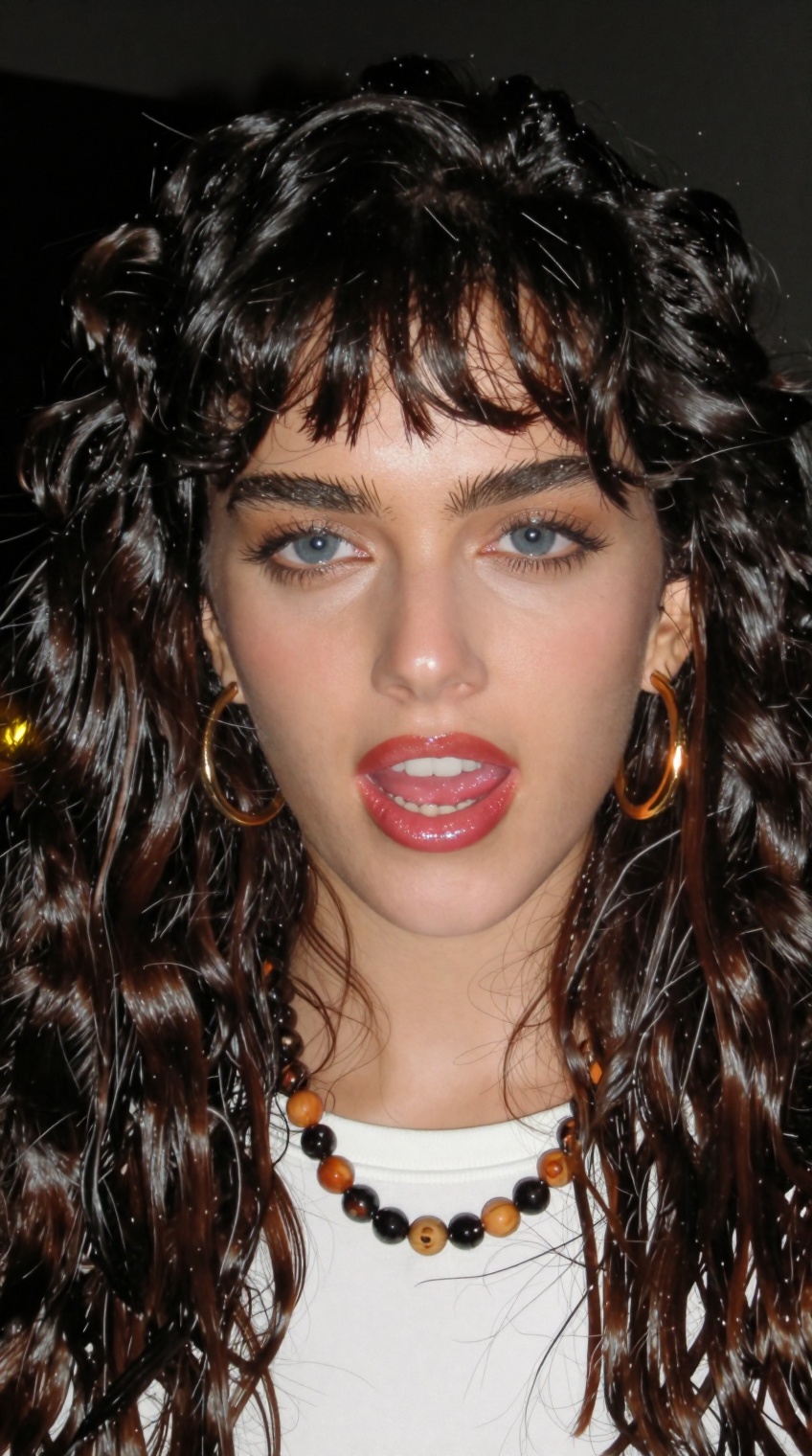 taken_by_ph0ne,  a woman with long,  wavy dark brown hair styled with soft bangs and voluminous curls framing her face is...