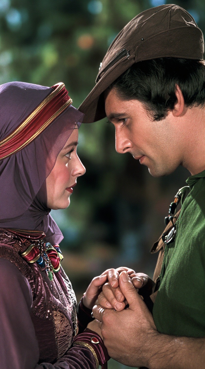 A woman in a deep purple veil with red and gold trim and a matching ornate bodice gazes intently at a man in a green tunic...