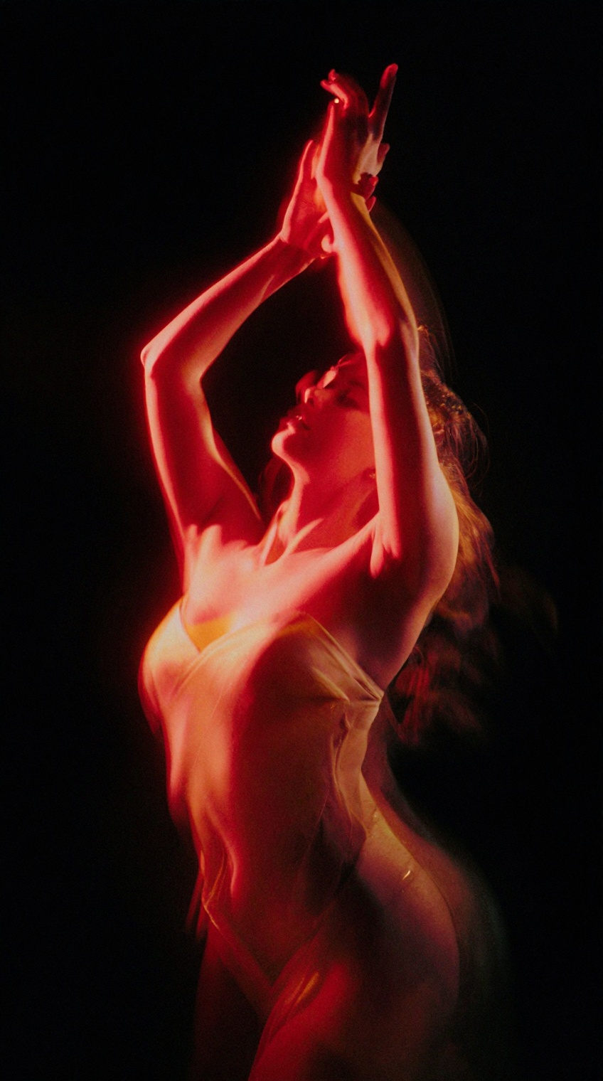 A cinematic,  high-contrast editorial portrait of a female dancer captured in a fluid,  expressive pose with both arms rai...