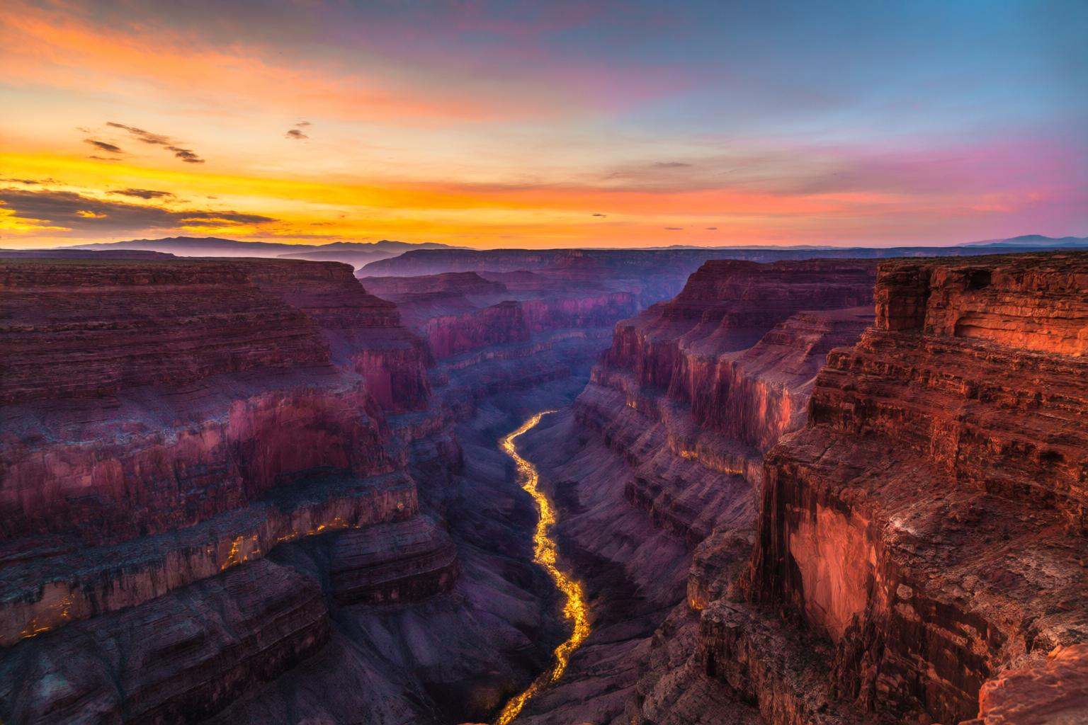 aurelmanea2q photography.A panoramic,  wide-angle landscape shot capturing the immense scale and dramatic beauty of the Gr...