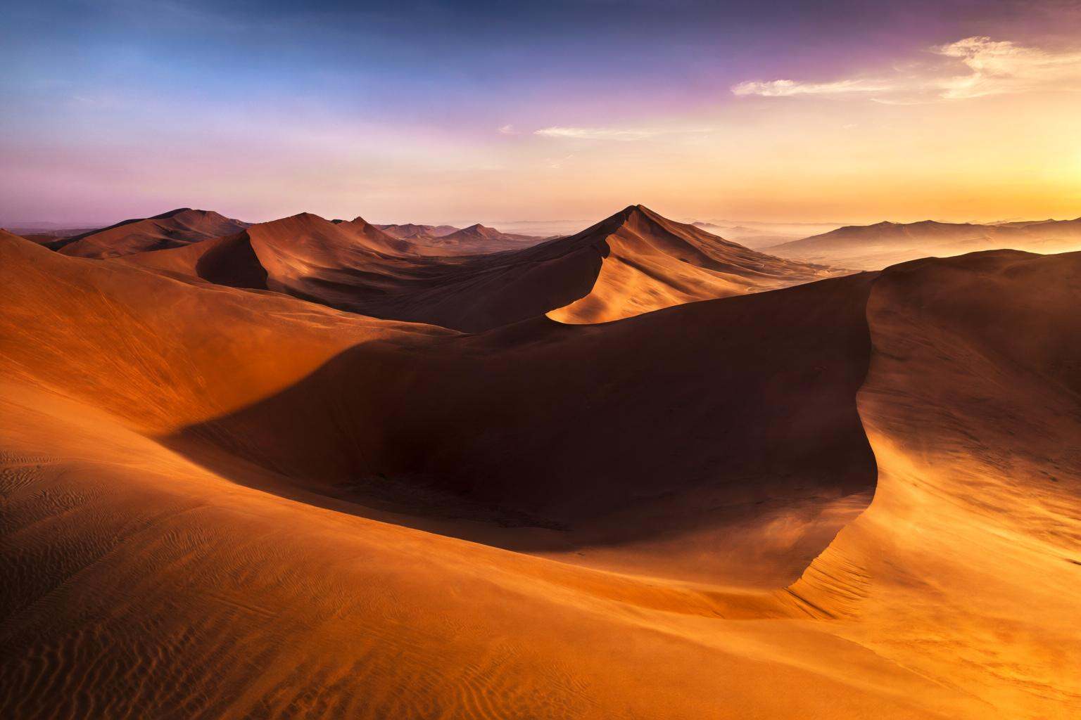 aurelmanea2q photography. A mesmerizing and vast desert landscape capturing the endless,  undulating sand dunes of the Sah...