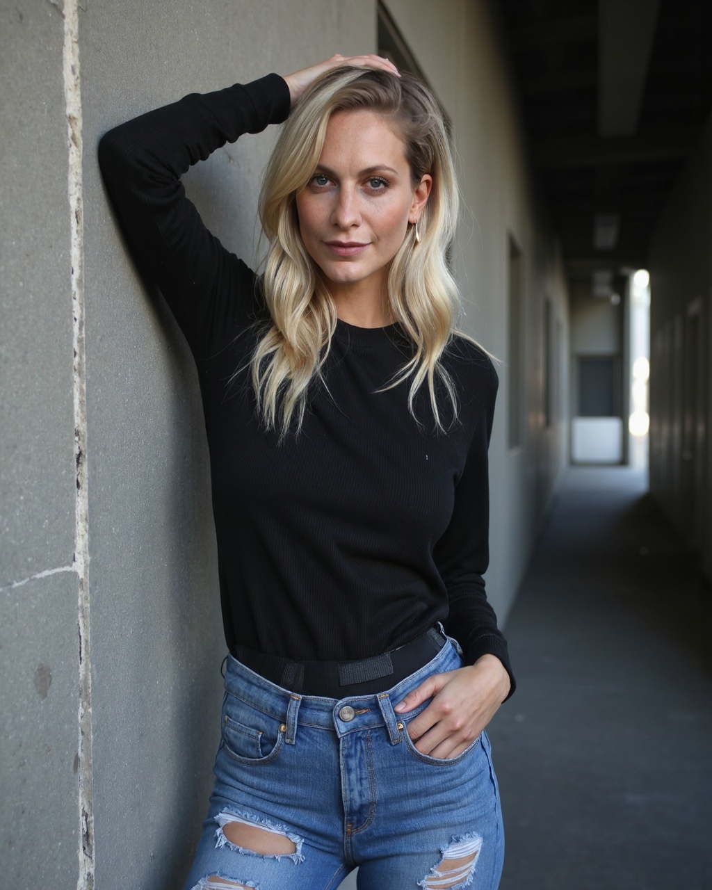 poppy_delevingne of South Asian descent leaning against a concrete wall in a urban setting. She has a medium-dark complexi...