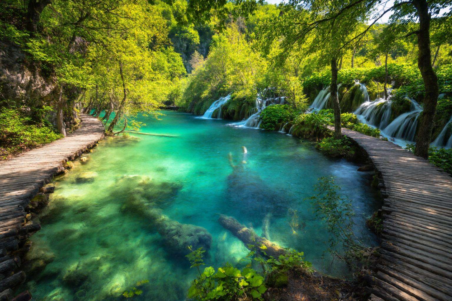 aurelmanea2q photography. A vibrant and enchanting landscape shot capturing the cascading terraced lakes and waterfalls of...