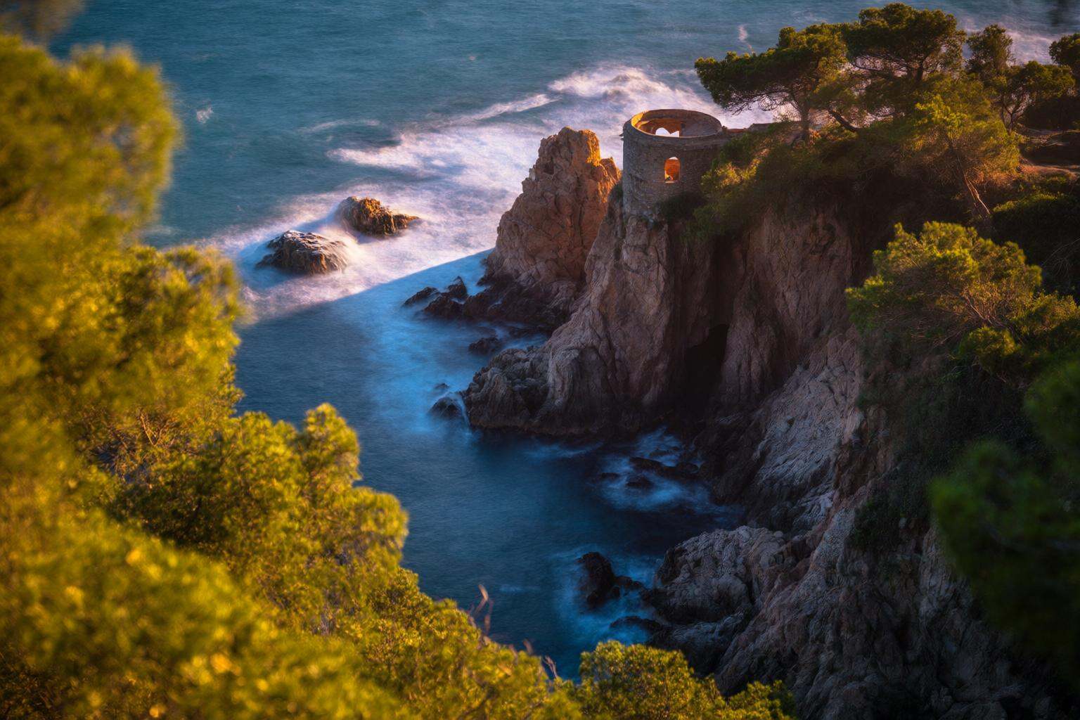 aurelmanea2q photography. A coastal scene with rugged cliffs and a small structure perched on top,  overlooking the ocean....
