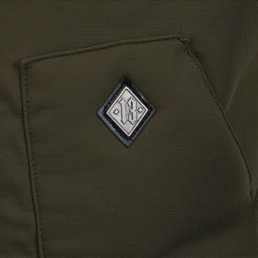 has a patch pocket with a diamond-shaped,  also in a contrasting fabric.,  revealing the inner lining which is dark and po...