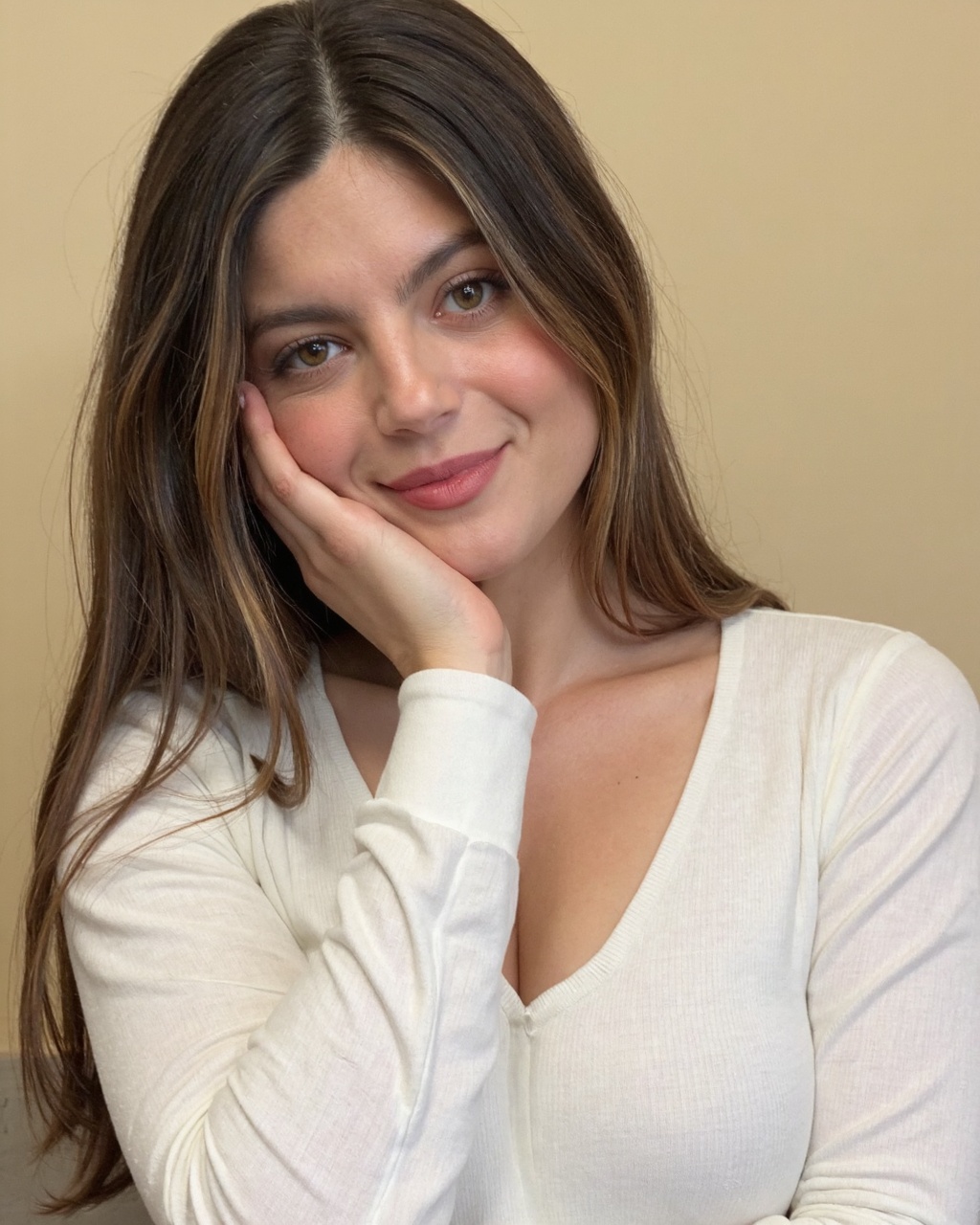 monica_barbaro with fair skin and long,  straight,  light brown hair that falls over her shoulders. She has a delicate on...