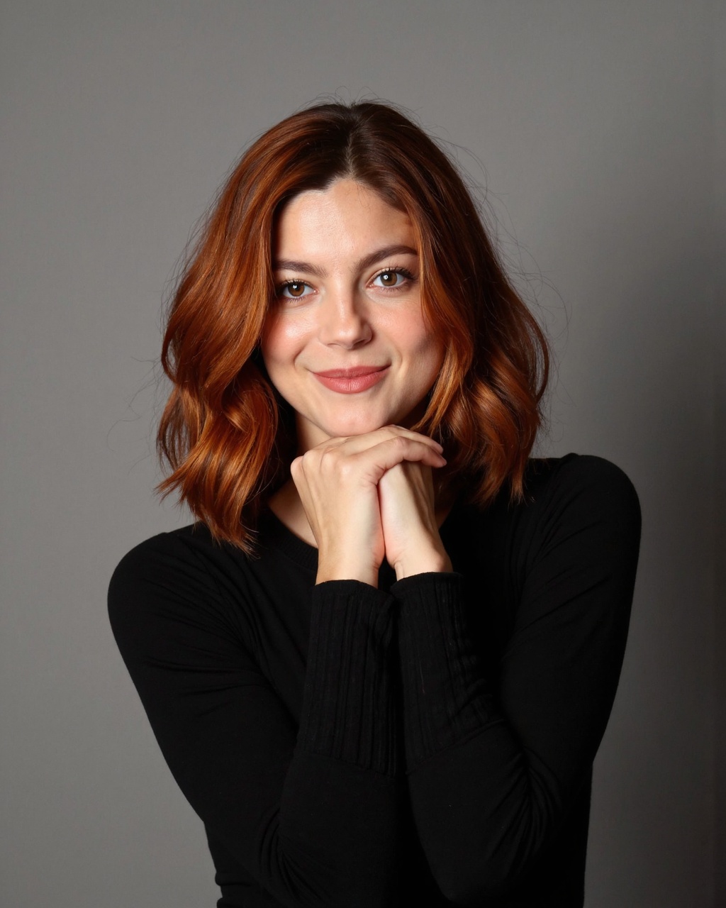 monica_barbaro with a fair complexion and striking,  wavy red hair that cascades around her shoulders. Her hair appears na...