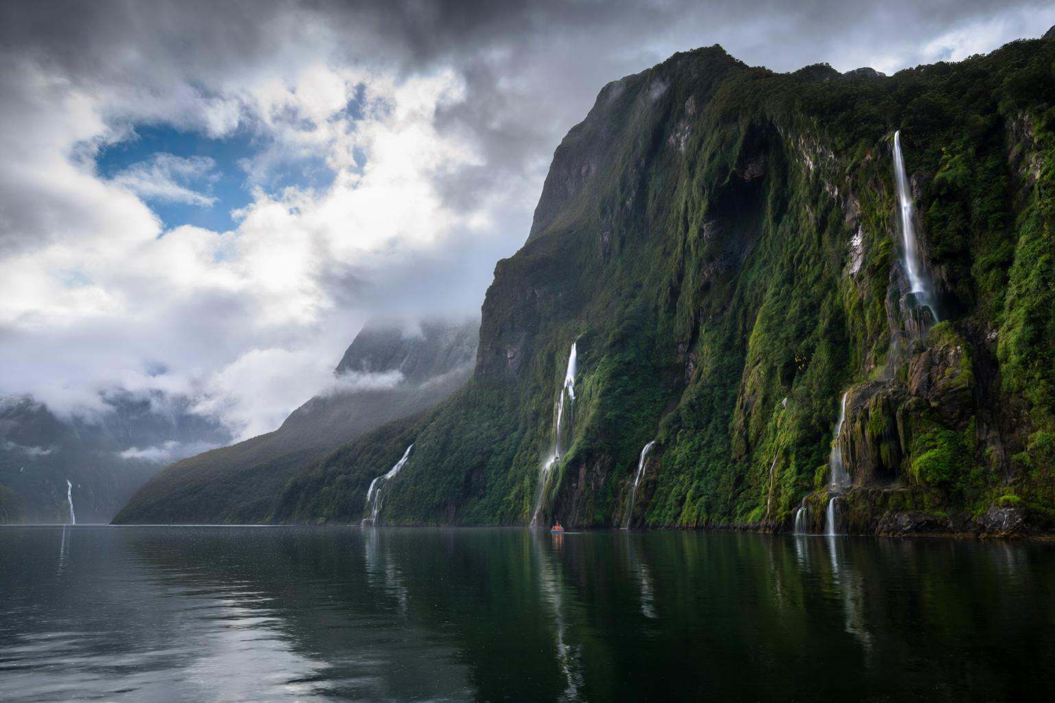 aurelmanea2q photography. A majestic and atmospheric landscape view of Milford Sound within Fiordland National Park,  New...