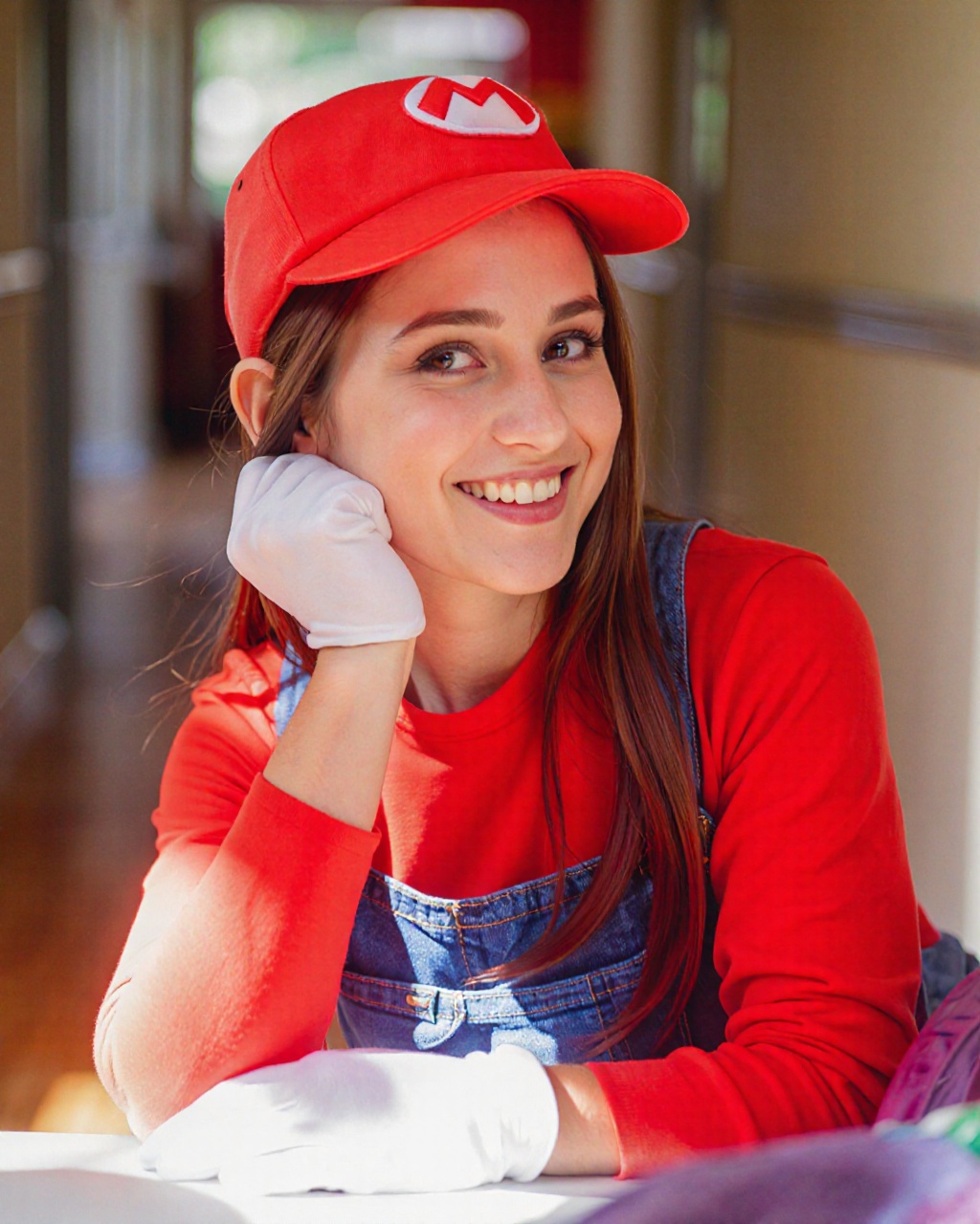This photograph captures a young woman dressed in a costume inspired by the iconic video game character Mario. She is posi...