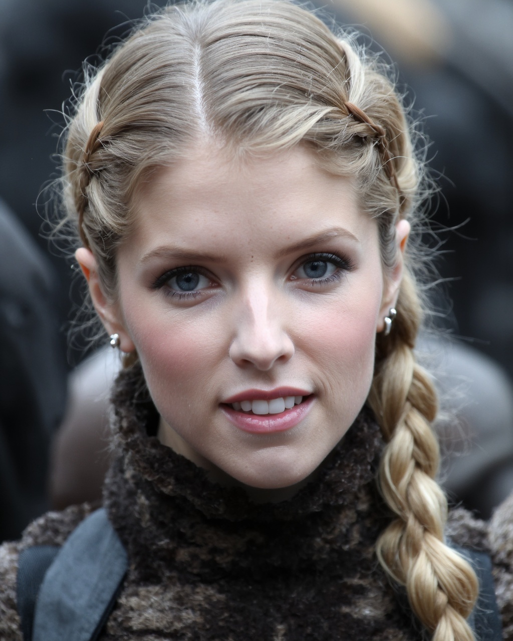 A close-up portrait of anna_kendrick with blonde hair styled in intricate braids. She has striking blue eyes and a neutral...