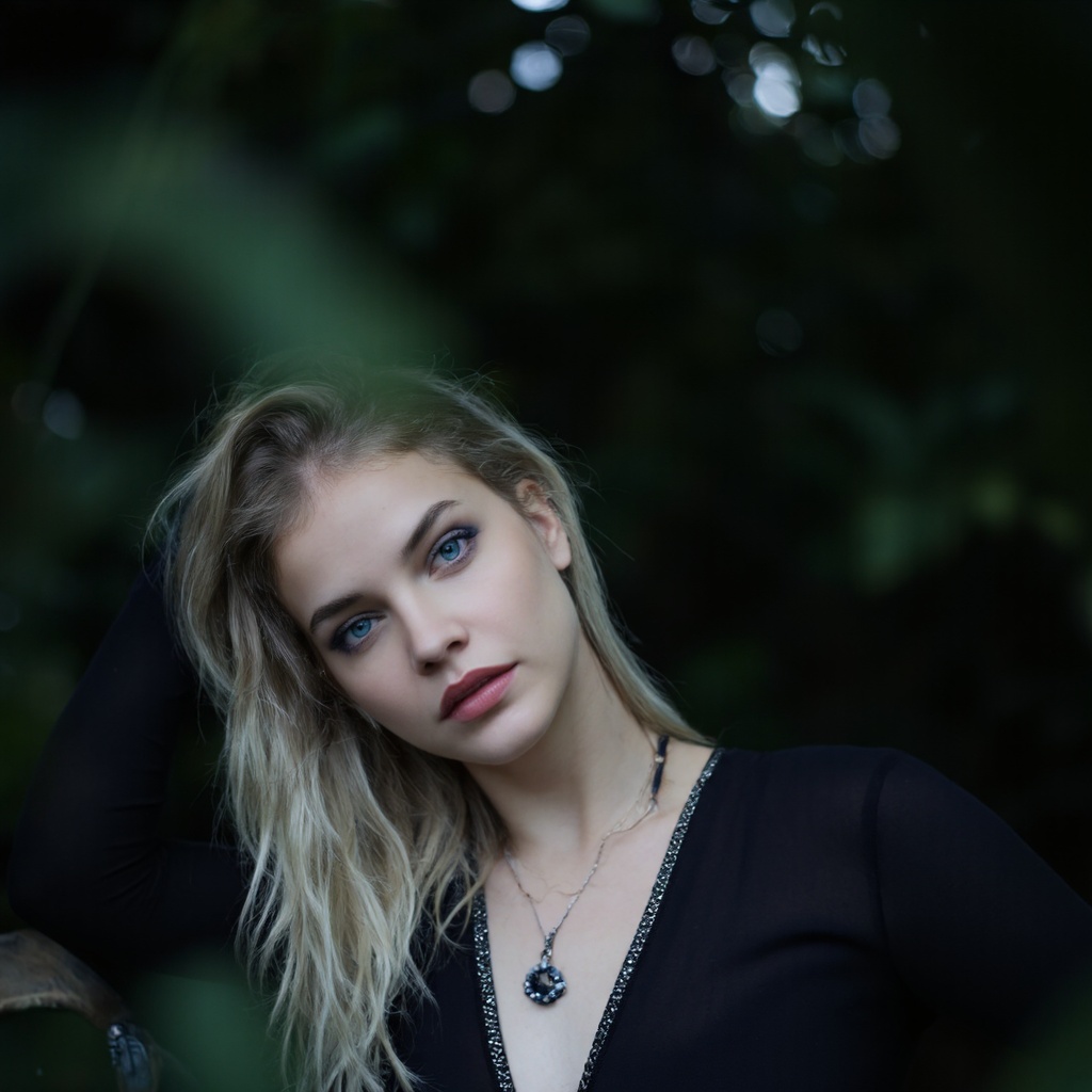 A portrait of barbara_palvin with long,  platinum blonde hair,  captured in a side profile. She wears a black on Tensor.Art
