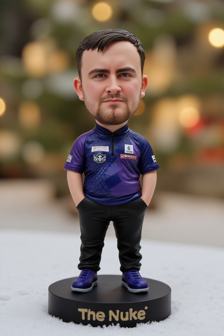 This is a high-resolution photograph of a detailed,  miniature bobblehead action figure of Luke Littler,  standing on a ro...