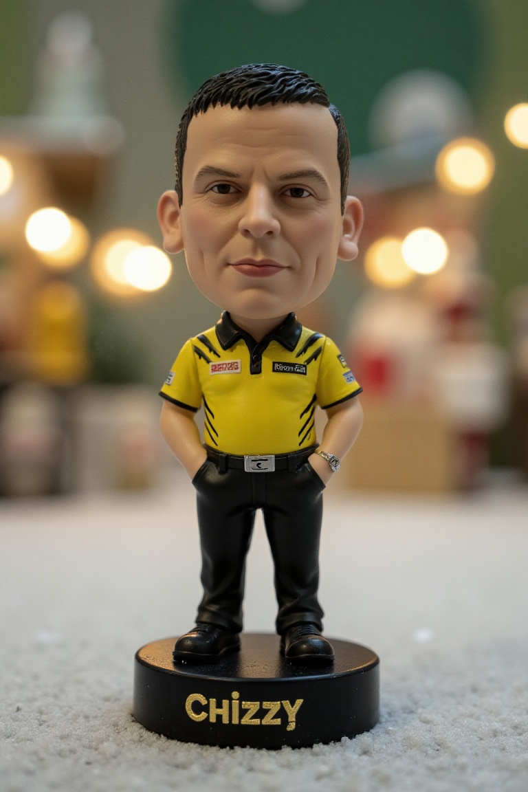 This is a high-resolution photograph of a detailed,  miniature bobblehead action figure of Dave Chisnall,  standing on a r...