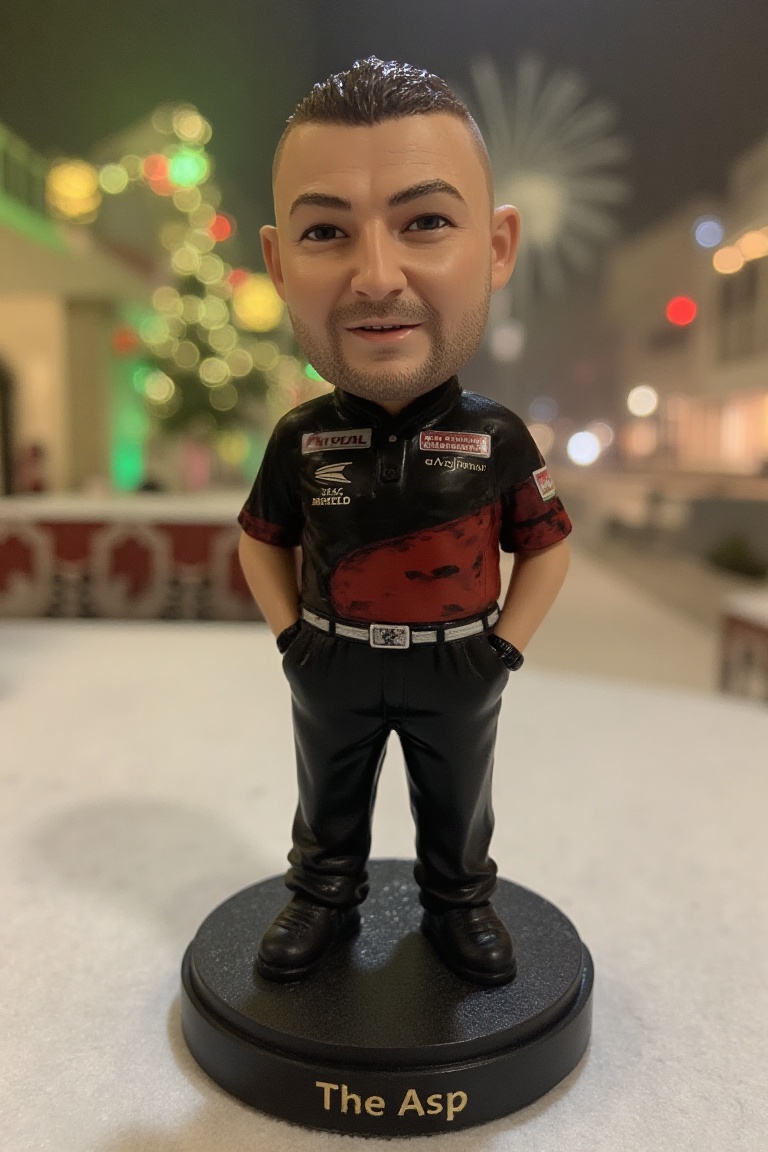 This is a high-resolution photograph of a detailed,  miniature bobblehead action figure of Nathan Aspinall,  standing on a...