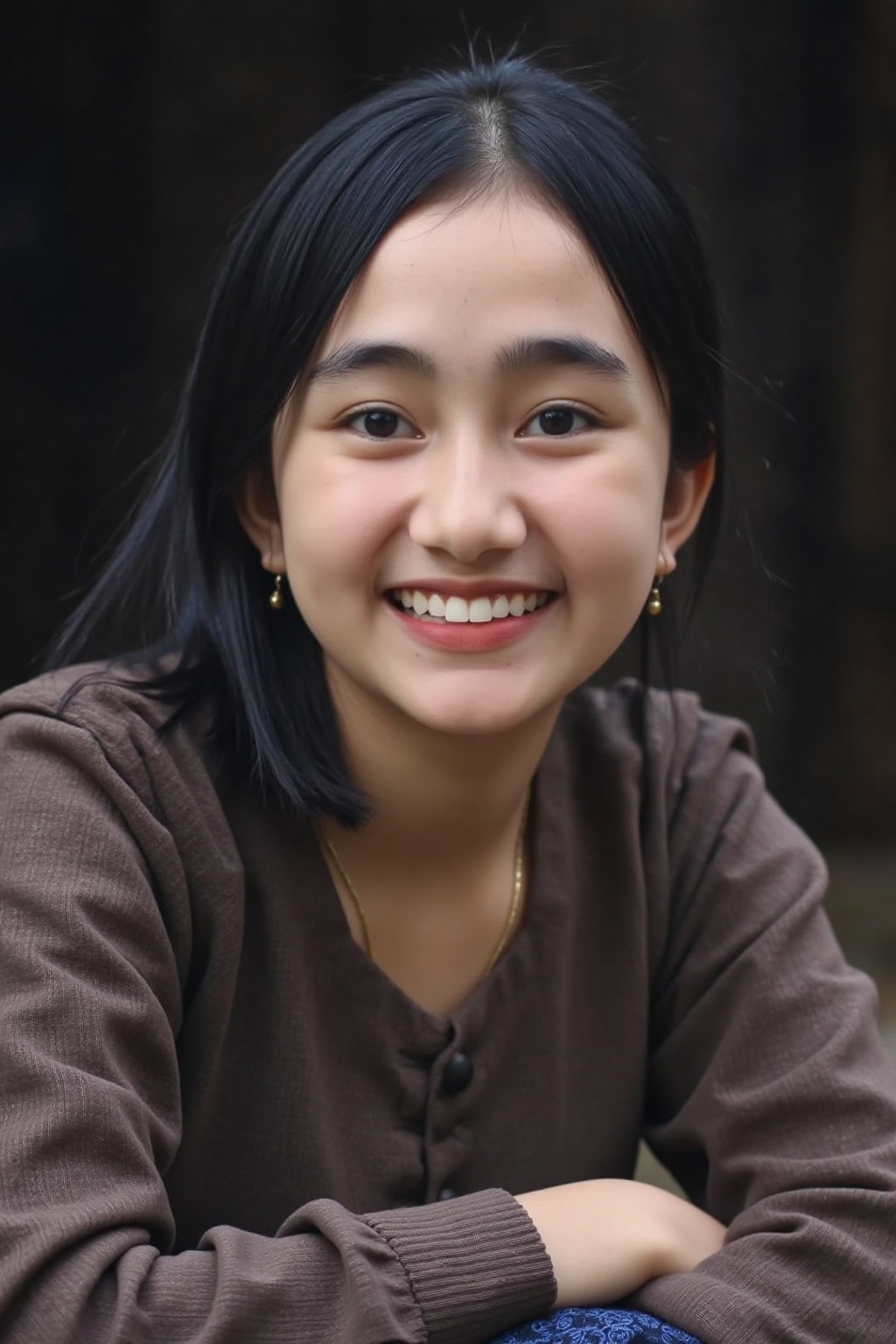 A close-up photo of rumsyah, A young asian woman. She is looking at the viewer with bright and loving eyes, grin with her teeth. She is leaning forwardal. Close-up of face, very detailed. She is wearing a perfect soft sweater. Hasselblad H6D-400c MS, low exposure, high contrast, ISO 100, with a 120mm macro lens.,