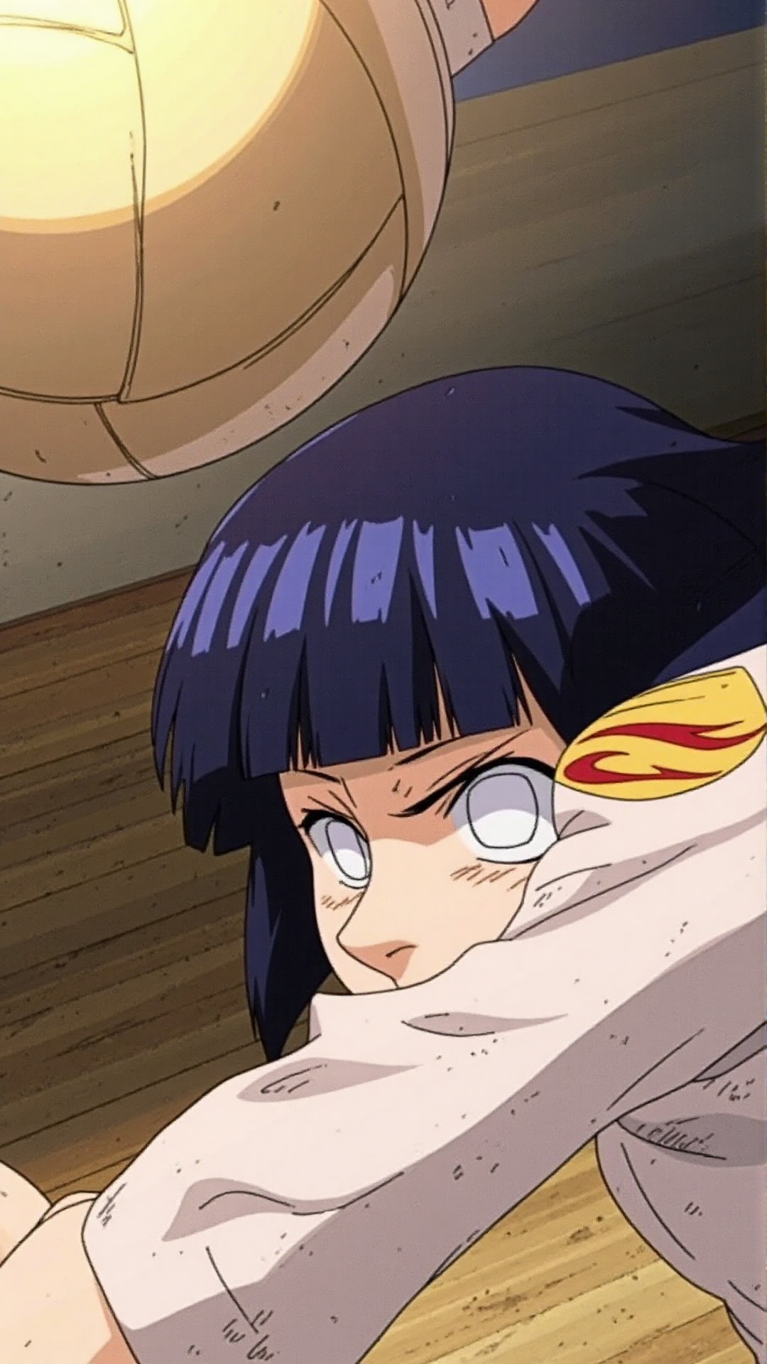 A close-up shot captures Hinata Hyūga's determined expression as she gazes intensely at a volleyball flying towards her. S...