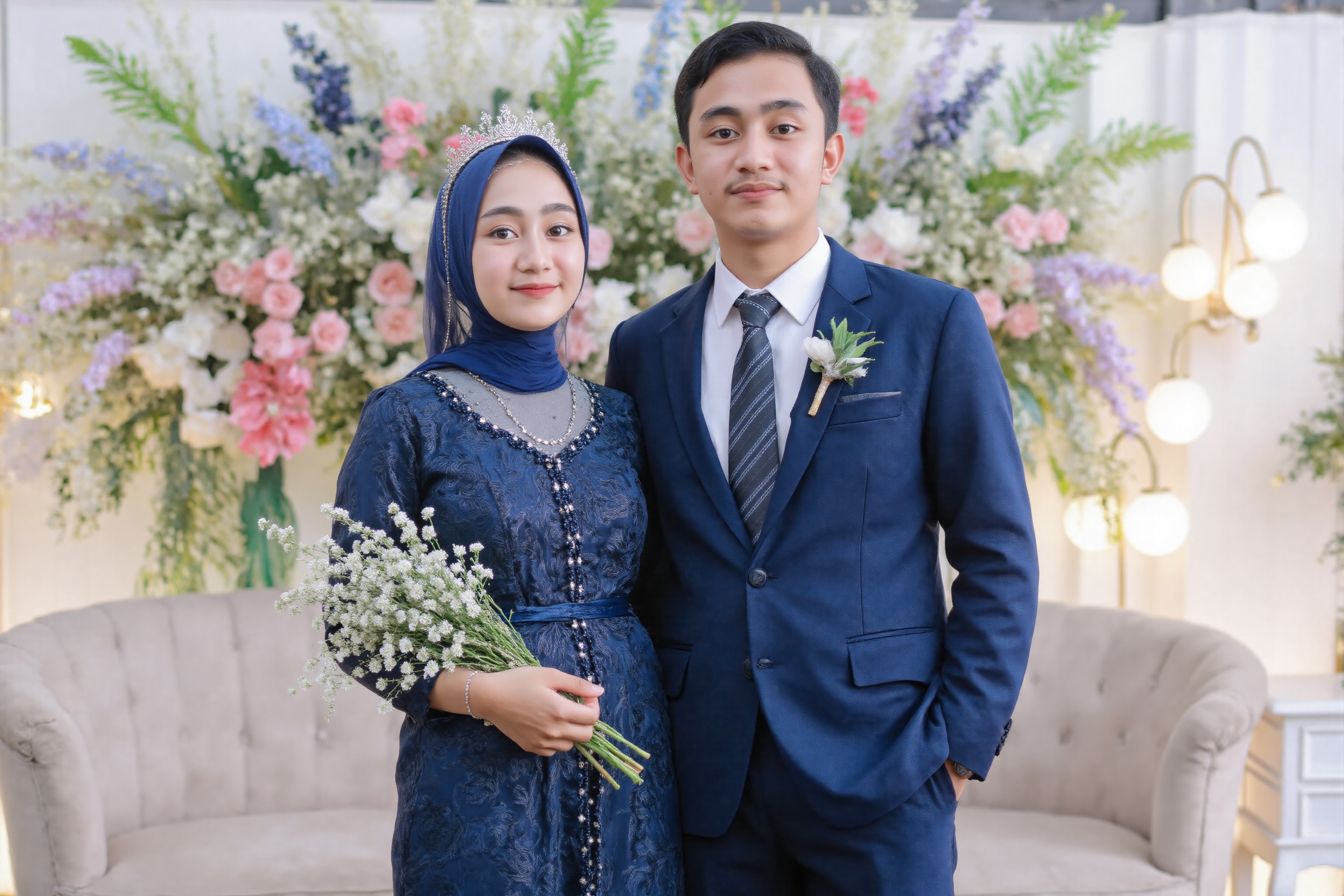wedding photography,  the bride and groom standing in front of a wedding backdrop,  rumsyah the hijab young asian woman on...