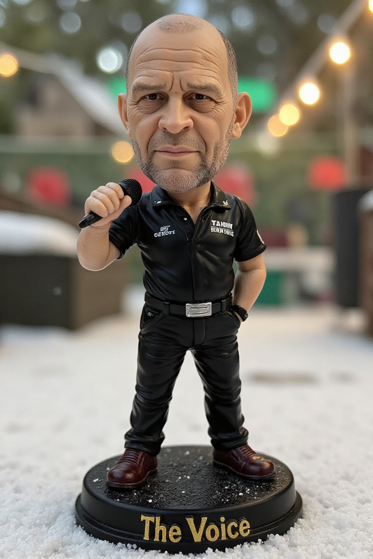 This is a high-resolution photograph of a detailed,  miniature bobblehead action figure of Russ Bray,  a balding man stand...