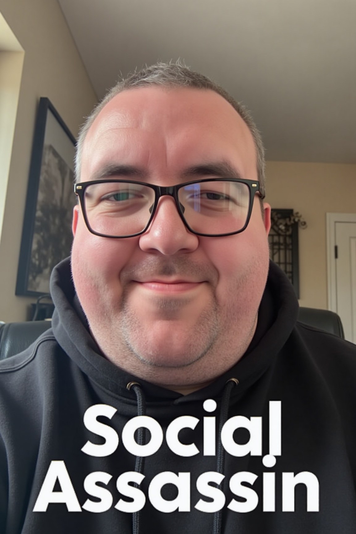 A high-resolution photograph of a man with glasses making a gurning face whilst taking a selfie. A caption underneath read...