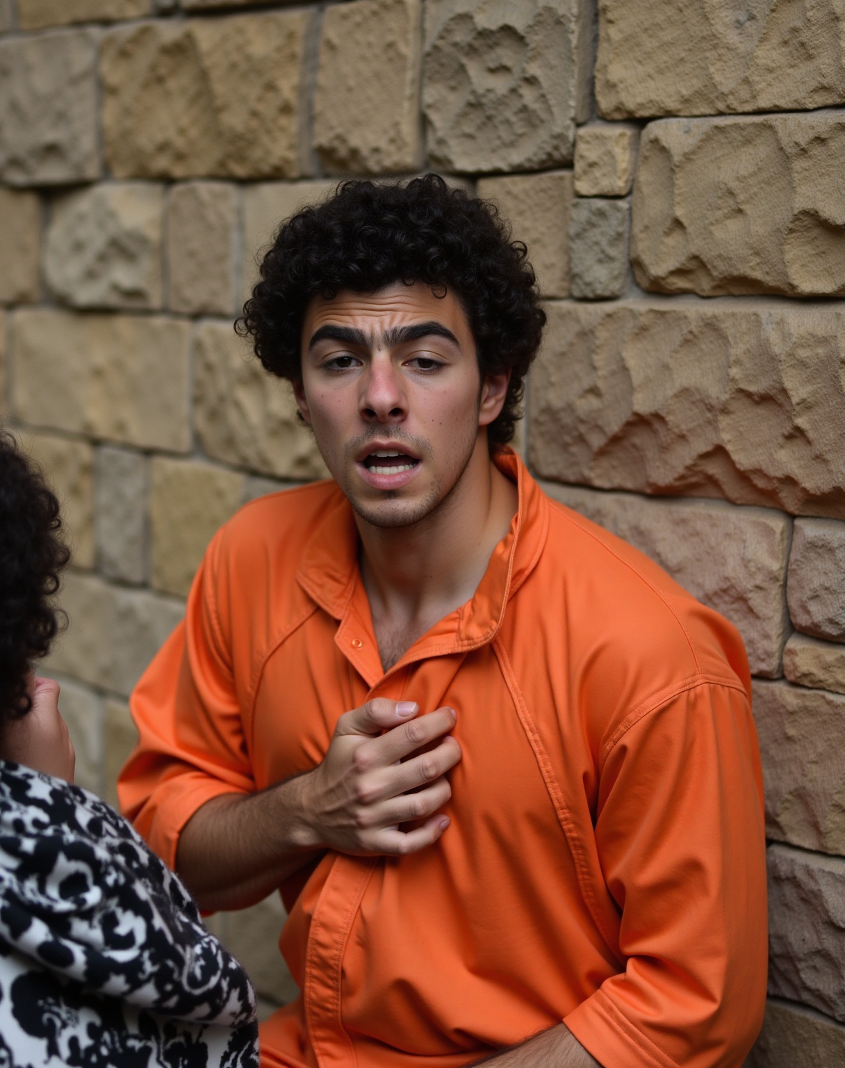 Luigi Mangione. The image is a photograph of a young man named Luigi Mangione with curly dark hair and a light complexion,...