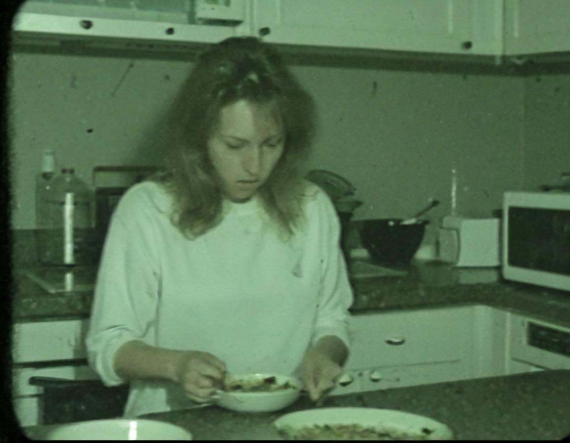 vhscore808,  A woman in kitchen,  preparing a meal on Tensor.Art