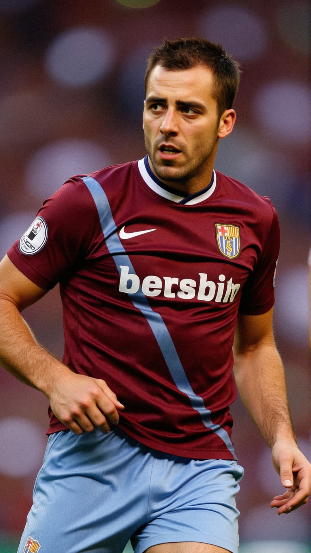 A focused male athlete in his 40s with short,  dark brown hair and a neatly trimmed beard,  wearing a maroon and light blu...