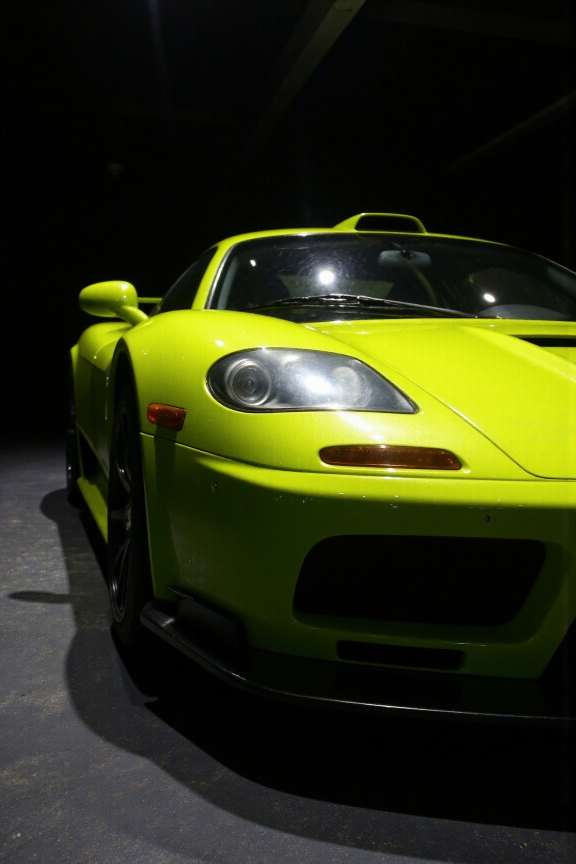 a neon yellow McLaren F1 GTR,  professional photography,  dark background on Tensor.Art