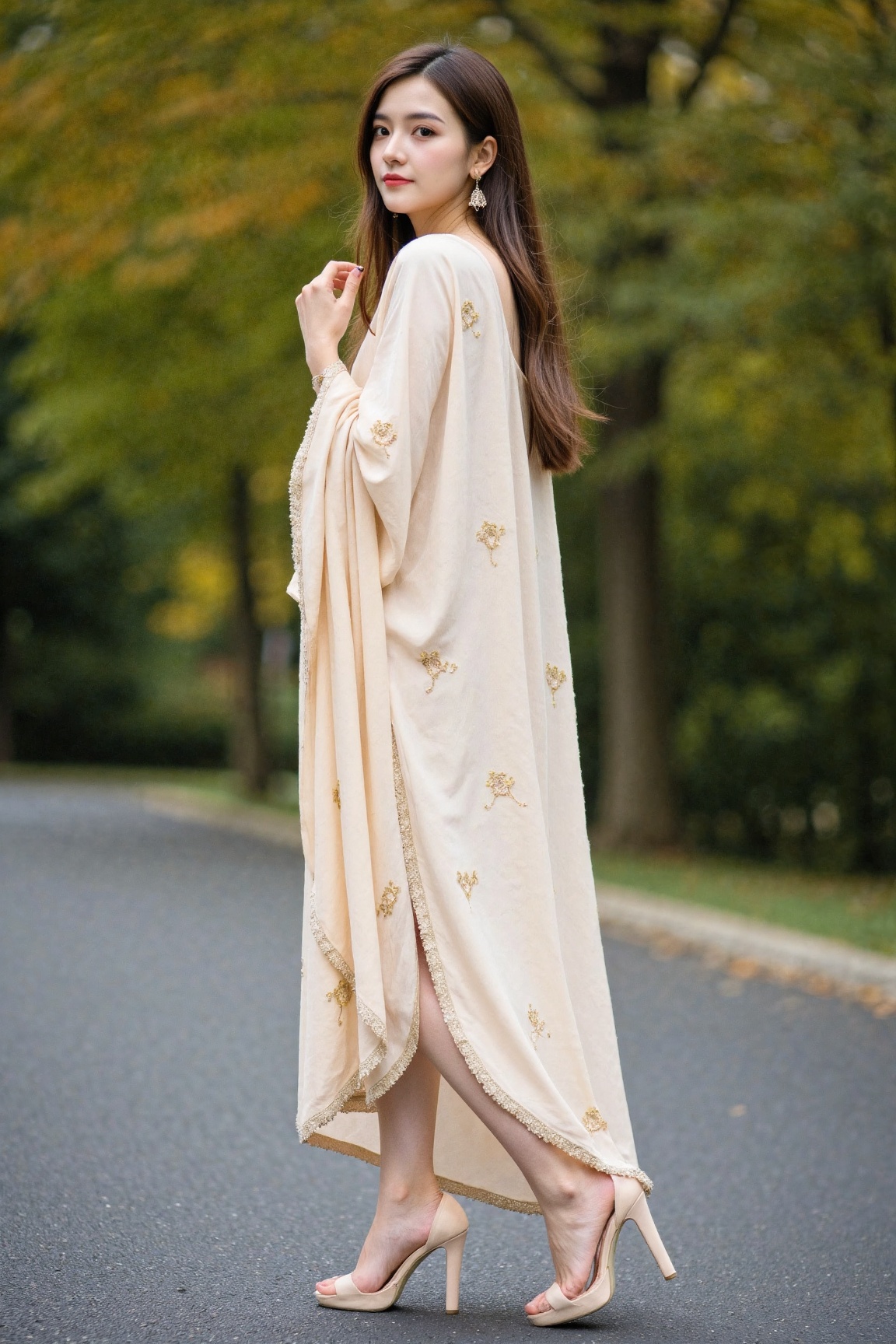 A woman stands facing slightly to the right,  looking over her left shoulder towards the viewer,  wearing a light peach-co...