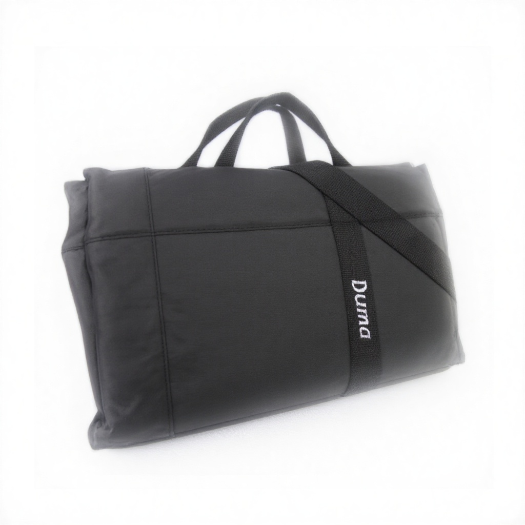 A bold and sleek product shot: a black rectangular duma bag. The bag has the word "Duma" written on it in white text. . Fr...