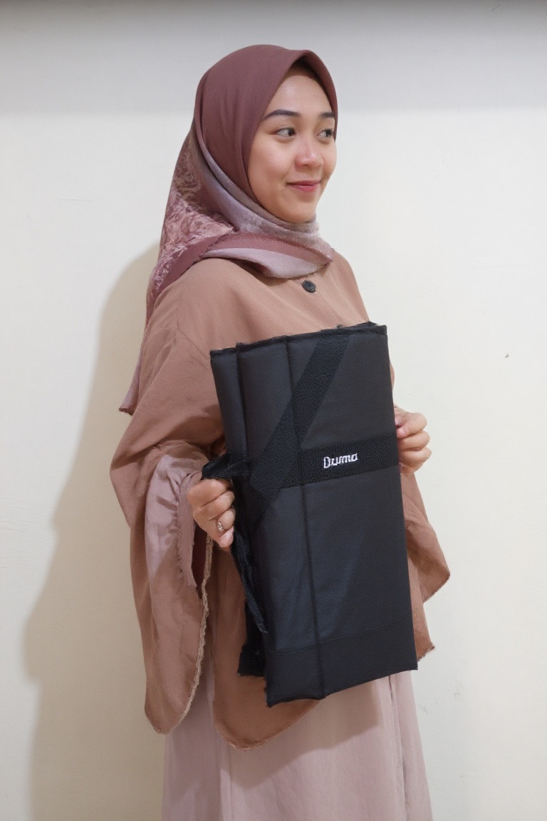 duma_bag,  The image shows mia,  a person wearing a brown hijab and a pink long dress on Tensor.Art