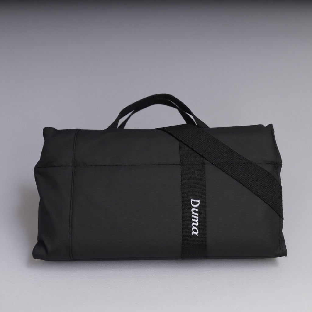 A product shot of a sleek black rectangular duma bag. The bag has the word "Duma" written on it in white text. against a n...