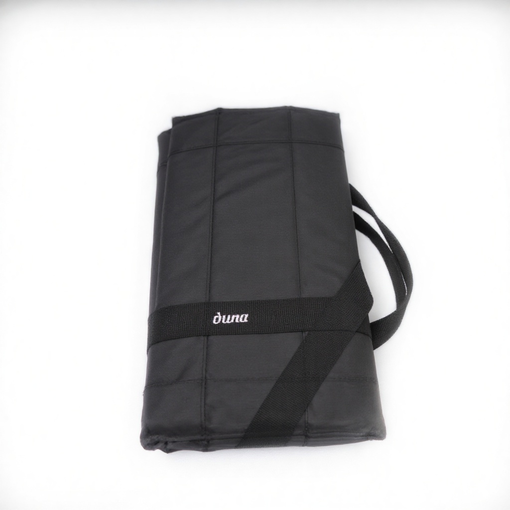 A bold and sleek product shot: A black rectangular Duma bag with bold typography reading Duma in metallic silver letters a...