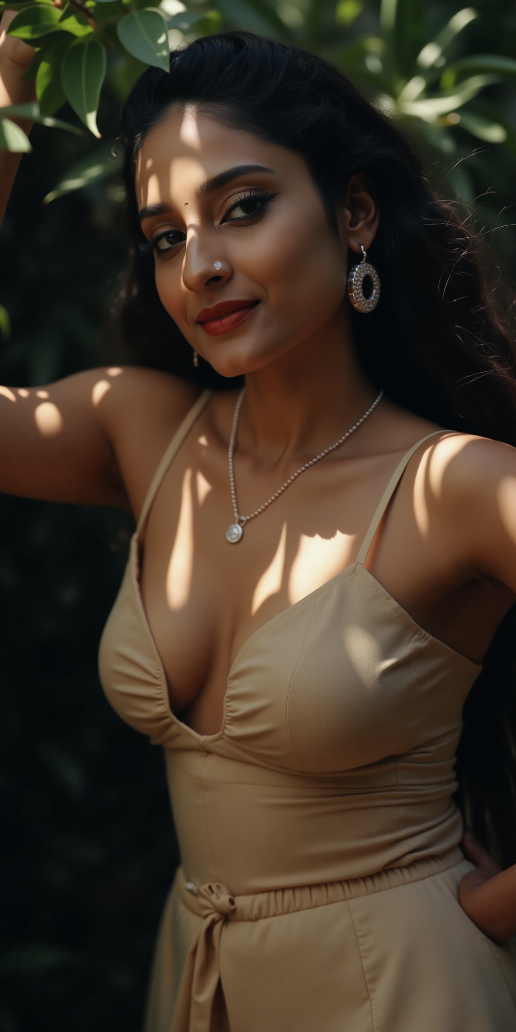 A stunning Indian actress,  Tamannaah Bhatia,  poses seductively in a modern dress showcasing her striking T-shaped navel....