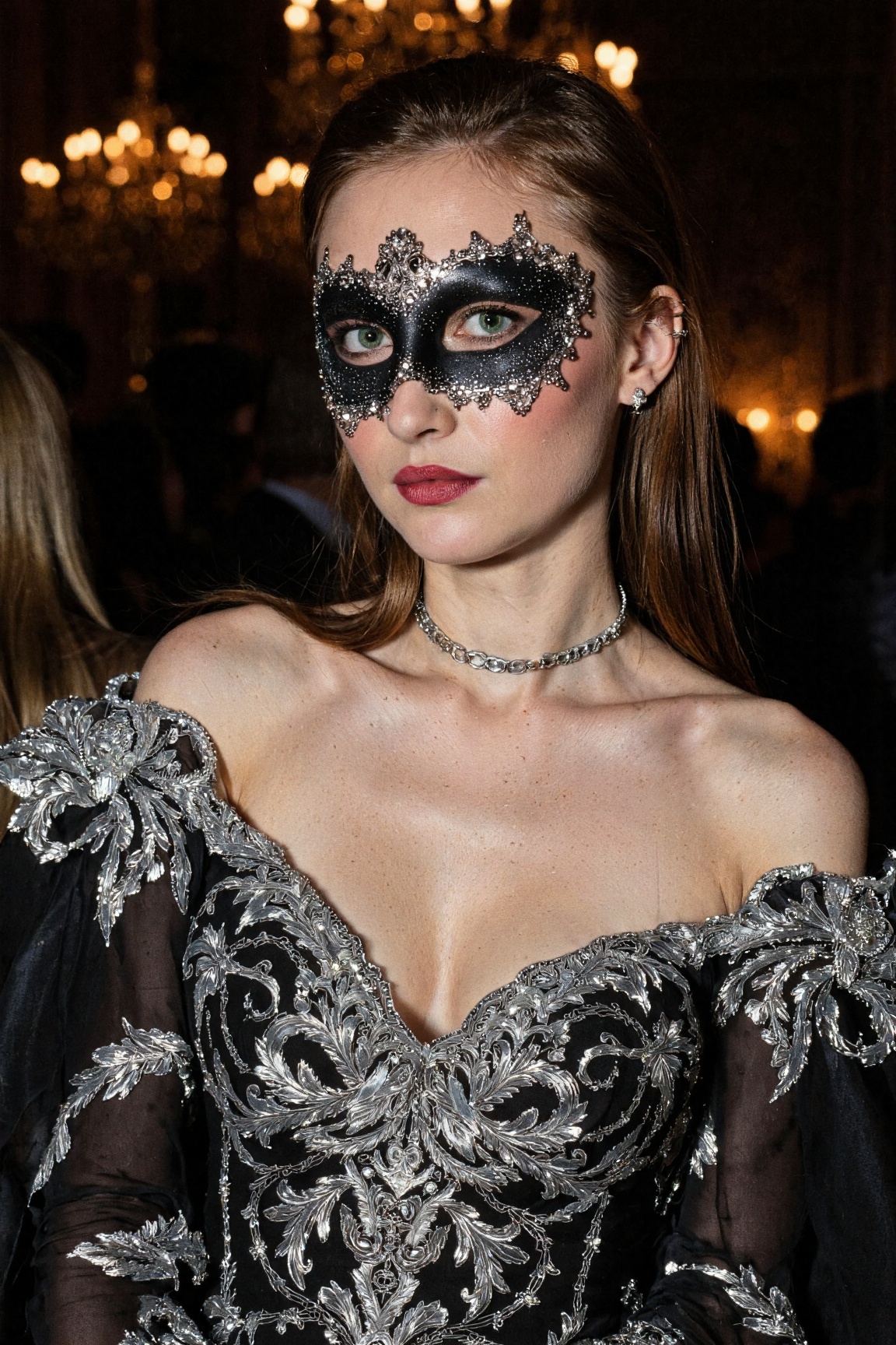 mysterious woman attending an enchanted masquerade ball,  dressed in a black and silver brocade gown with intricate embroi...