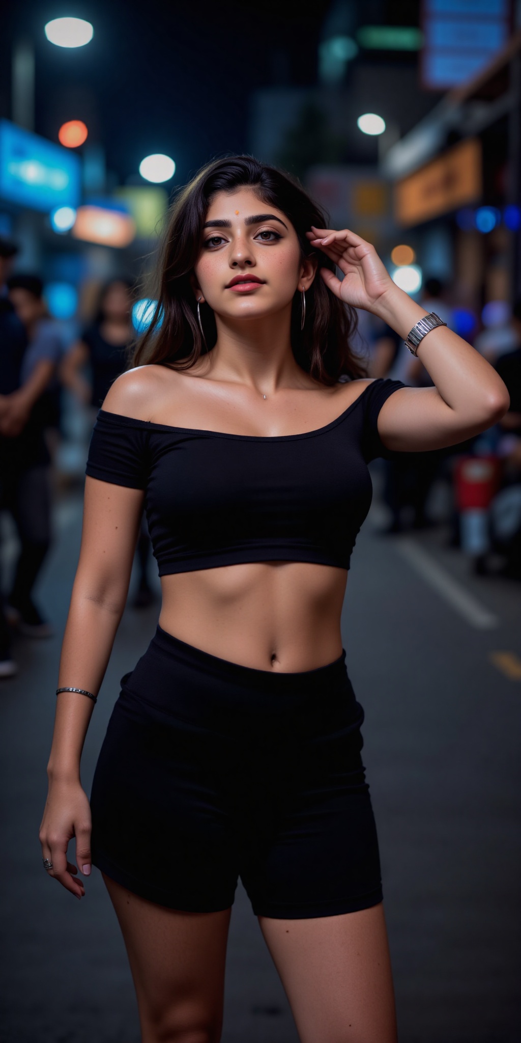 Indian woman A young woman with light brown skin and dark wavy hair stands in a narrow dimly lit Asian street at night. Sh...